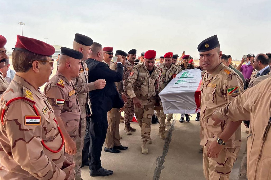 The bodies of three Iraqi soldiers who were killed in a pre-dawn attack blamed on the Islamic State group, are repatriated from Kirkuk airport in northern Iraq, June 11, 2023. (Photo: Marwan Ibrahim/AFP)